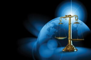 Blue picture of the earth and gold scales of justice, bankruptcy, workers' compensation